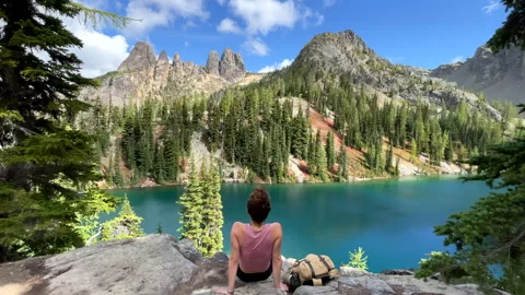 Sitting on a cliff edge while hiking in the Pacific Northwest, Washington Stock Footage 241794851