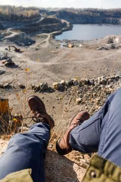 Sitting on a cliff Stockfoto's