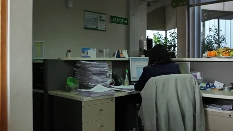 Sitting at desk Stock Footage 77052145