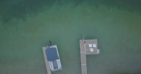 SITTING ON A DOCK Stock Footage 127886945