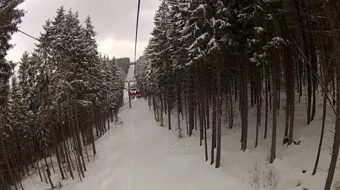 Sitting down on the ski lift in Bukovel, Ukraine Stock Footage 48597077
