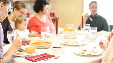 Sitting down for thanksgiving day dinner Stock Footage 61660399