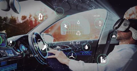 Sitting driver wearing VR headset and grasping steering wheel in car cabin, with Stock Photos