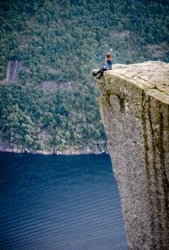 Sitting at the edge of a cliff Stock Photos