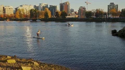 Sitting on the edge of Fraser river in a beautiful park Stockbeeldmateriaal 144465382