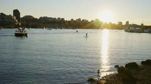 Sitting on the edge of Fraser river in a beautiful park 스톡 동영상 144465512