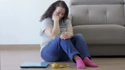 Sitting on the floor with a scale Video stock 268239619