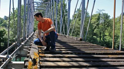 Sitting on Hayden Bridge looking down Stock Photos