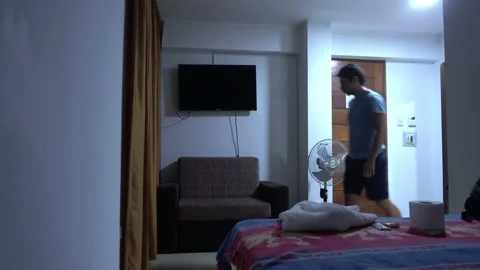 Sitting on the hotel sofa and checking the cell phone Stock Footage 196732772