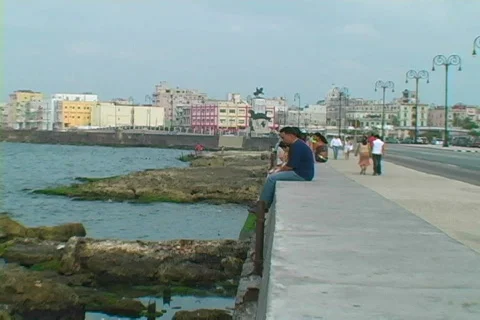 Sitting on the malecon Stock Footage 397429