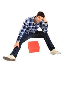 Sitting man with a box Stock Photos
