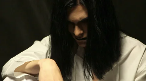 Sitting man with long hair Video stock 59121692