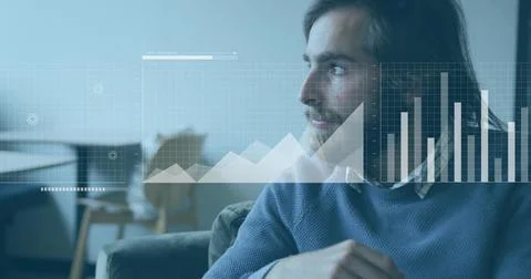 Sitting man in sweater on sofa in lounge near round table, data charts, copy Stock Photos