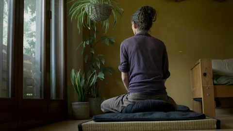 Sitting in meditation Stock Footage 76794788