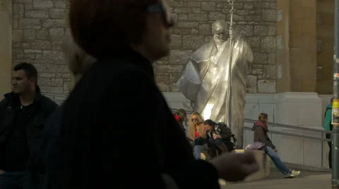 Sitting next to the Karol Wojtyla statue in Fra Grge Martica square, Sarajevo Stock Footage 59856865