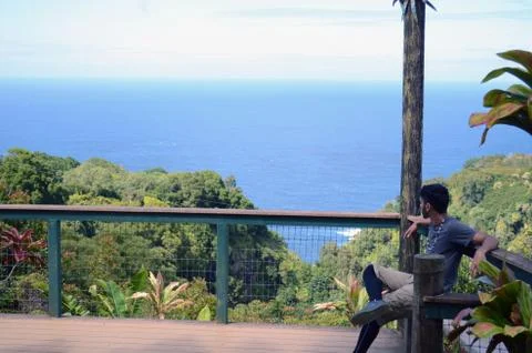 Sitting by the ocean Stock-Fotos