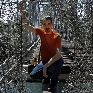 Sitting on old Train Bridge Stock Photos