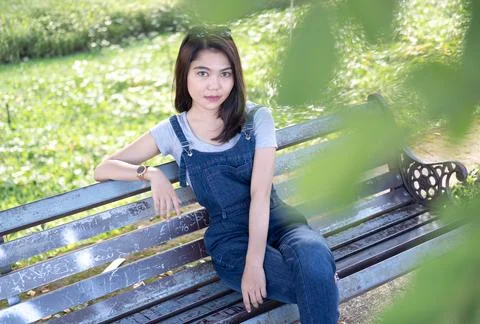 Sitting on a park bench Stock Photos