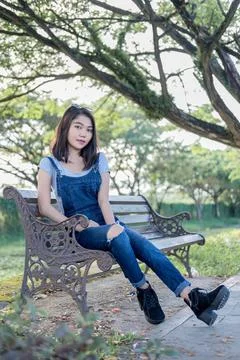 Sitting on a park bench Stock Photos