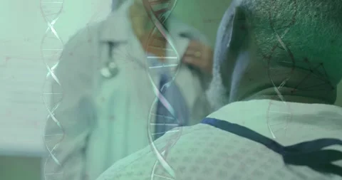 Sitting patient in patterned gown at clinic, whitecoat doctor adjusting Stock Footage 330463442