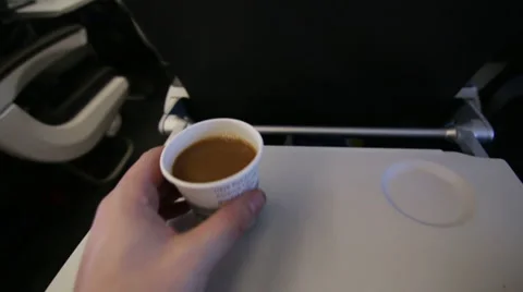 Sitting on Plane Drinking Coffee POV Stock Footage 47562399