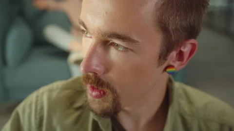 Sitting in the rest zone in the university, a young student is talking to his Stock Footage 175491005