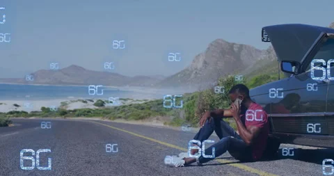 Sitting on roadside, man using smartphone with 6G technology animation over Stock Footage 305622276