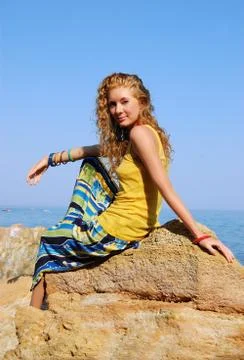 Sitting on rocks Stock Photos