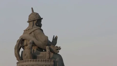 Sitting Statue against the sky Stock Footage 72591494