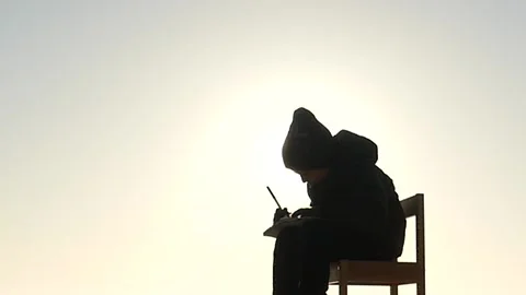 Sitting on stool 5 years old boy painting on paper isolated silhouette Stock Footage 172431225