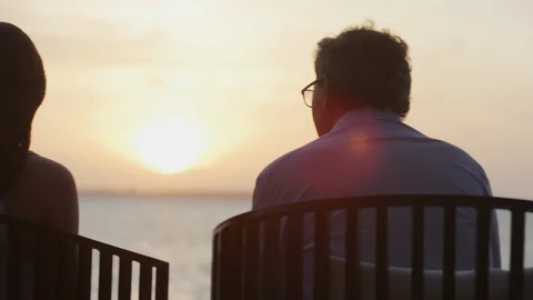 Sitting in the sunset at the beach 動画素材 95538364