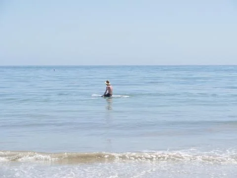 Sitting Surfer in Hat 写真素材