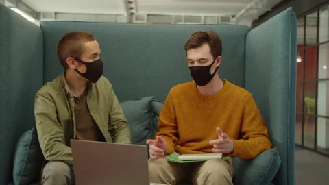 Sitting together in the rest zone in the university, young students are Stock Footage 175370812