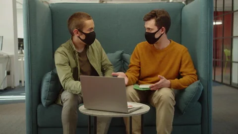 Sitting together in the rest zone in the university, young students are arguing Stock Footage 175412650