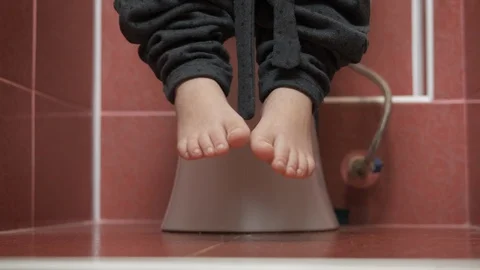 Sitting on toilet. Stock Footage 129523656