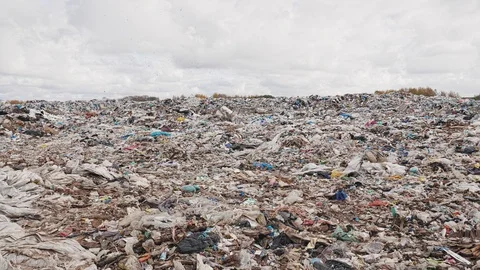 Сity garbage dump, environmental pollution due to lack of recycling technology Stockbeeldmateriaal 97695073