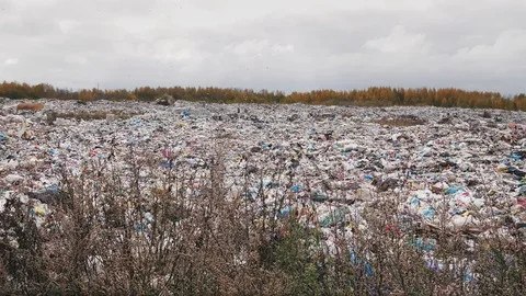 Сity garbage dump, environmental pollution due to lack of recycling technology Stockbeeldmateriaal 97695847