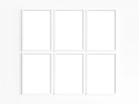 Six A4 white frames with portrait orientation on a light wall 库存照片