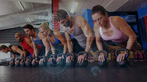Six adults doing kettlebell pushups in gym while camera panning up HUD showing Stock Footage 333526167