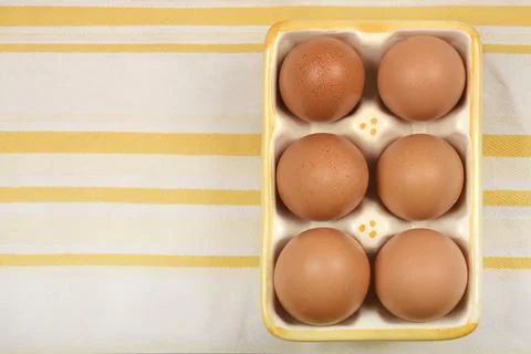 Six brown eggs Stock Photos