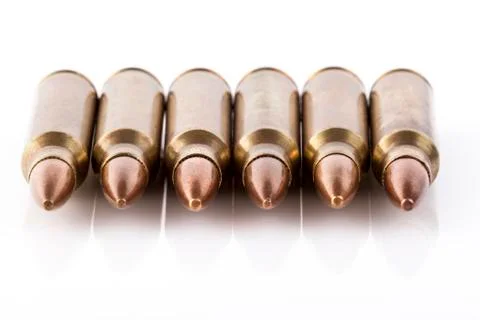 Six bullets front Stock Photos