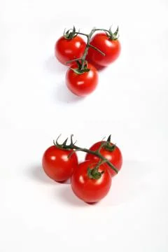 Six cherry tomatoes on white Stock Photos