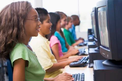 Six children at computer terminals (depth of field/high key) Stock Photos