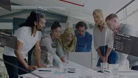 Six colleagues leaning and pointing at laptop initiating AR panels showing code Stock Footage 333494374