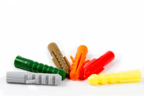 Six colored rawl plugs Stock Photos