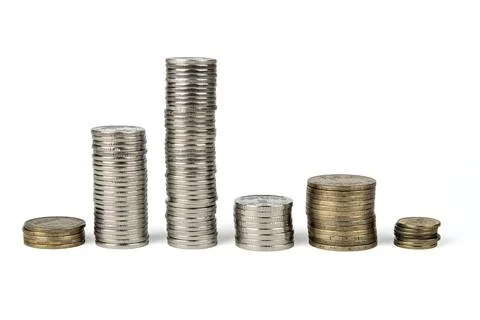 Six columns of different heights made of coins of various denominations Stock Photos