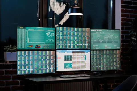 Six computer monitors displaying stock market data Stock Photos