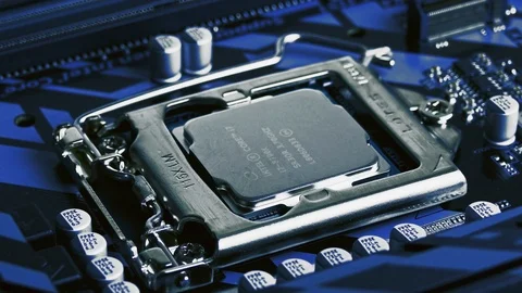 Six-Core Intel Core I7 8700K Processor Removed From Computer Motherboard CPU Stock Footage 121775408