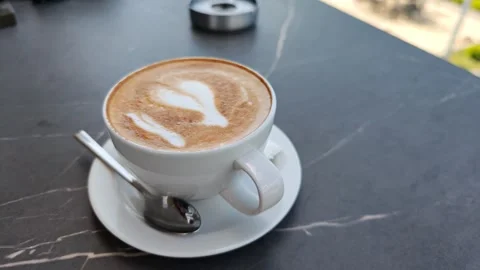 Six cups of cappuccino resting on a table Vidéo 311406249