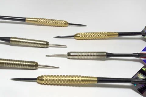 Six darts needles closeup. Sharp Steel. Brass and stainless steel barrels 写真素材